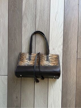 Maxx New York Y2K handbag features a distinct animal-print pattern
